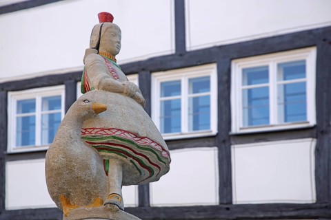 Schwälmer fountain with Little Red Riding Hood and goose figure, Gänseliesel, fairy tale figure,
