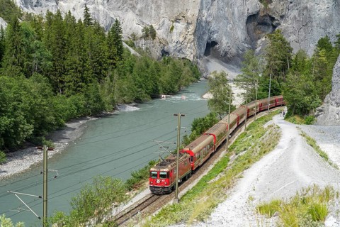 A Rhaetian Railway train travels through the Rhine Gorge, Ruinaulta, Anterior Rhine, Versam,