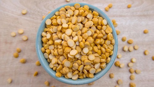 Flat Lay of Split Chickpeas Lentils in a Blue Bowl, Top View