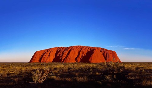 Ayers Rock Uluru at sunset, illuminated in red light, Northern Territory, Australia, Oceania
