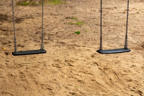 2 swings on a children's playground