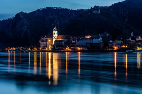 Morning atmosphere at the river, view over the Danube to Dürnstein, blue hour in front of sunrise,