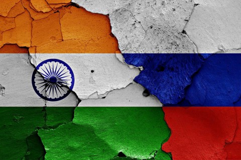 Flags of India and Russia painted on cracked wall