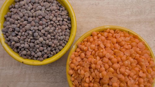 Split Red Lentils and Whole Brown Lentils in Yellow Bowl, Vegan Food, Top View, Healthy Legume