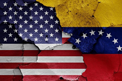 Flags of USA and Venezuela painted on cracked wall