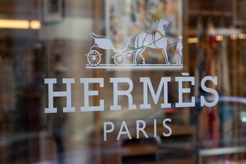 Close-up, logo of the French luxury fashion brand Hermes on a boutique in the shopping street Neuer