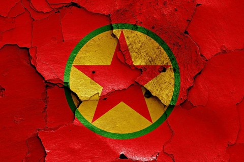 Flag of PKK painted on cracked wall