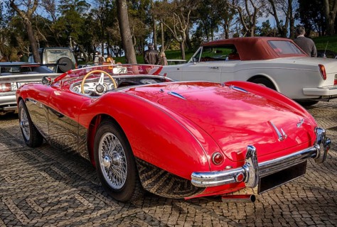 Lisbon, Portugal, Jan 20, 2024: Rear view of two-tone Reno red and black Austin-Healey 100 vintage