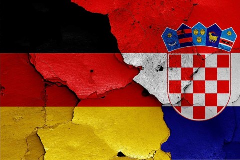 Flags of Germany and Croatia painted on cracked wall