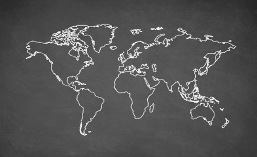 World map drawn on chalkboard. Chalk and blackboard