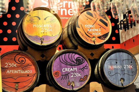 Madrid, Spain, Europe, wooden barrels with colourful painting and price indications in an interior,