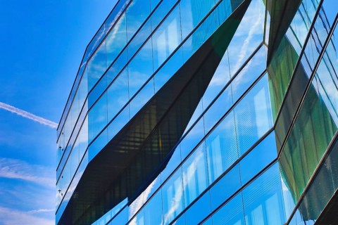 Detail of a glass façade with reflections of the sky in modern style, Prime Tower, Zurich, glass
