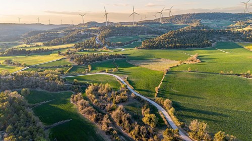 Aerial view of windmills on the hills between fields of cereal cultivation in the province of
