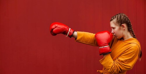 Teenagers posing with boxing gloves