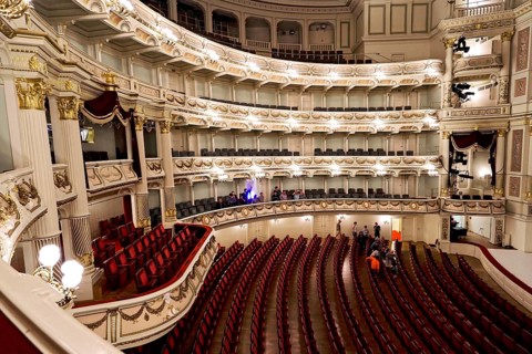 Semperoper, Dresden, Saxony, Germany, Europe, Large opera hall with red empty rows of seats,