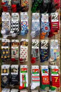 Souvenir gift shop display rack of novelty socks, Guimaraes, northern Portugal