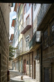 Street of historic buildings with balconies, city centre Guimaraes, northern Portugal