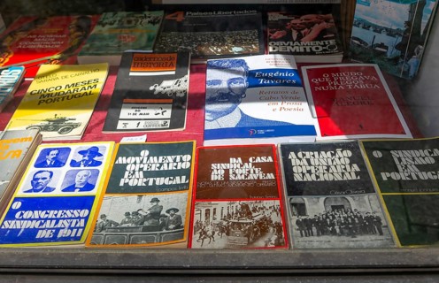 Secondhand History books on display inside window of Loja do Julio bookshop, Guimaraes, Portugal,
