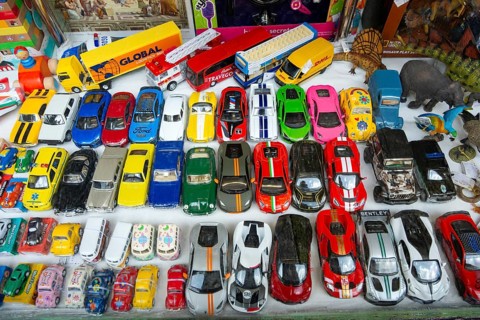 Toy model cars on display in toy shop window, city of Guimaraes, northern Portugal