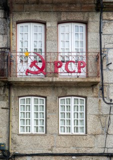Hammer and sickle sign on PCP Portuguese Communist Party building, city centre Guimaraes. Portugal