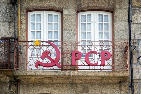 Hammer and sickle sign on PCP Portuguese Communist Party building, city centre Guimaraes. Portugal