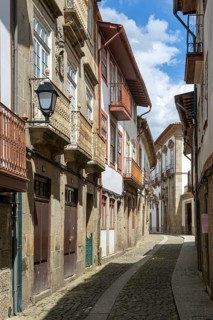 Street of historic buildings with balconies, Rua João Lopes de Faria, city centre Guimaraes,