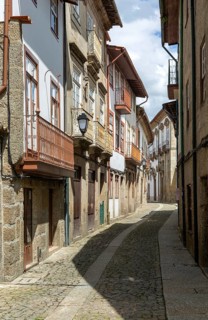 Street of historic buildings with balconies, Rua João Lopes de Faria, city centre Guimaraes,