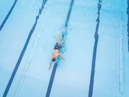 Close-up of a swimmer in motion in a clear pool, Calw outdoor pool, Black Forest, Germany, Europe
