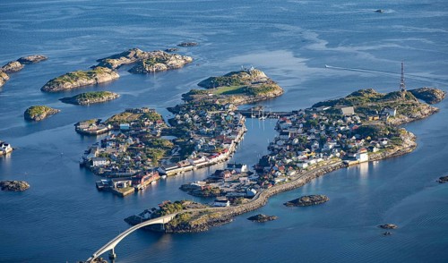 Houses on small rocky islands in the sea, view of Henningsvær, Vågan, Lofoten, Nordland, Norway,