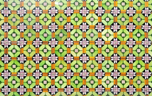 Bright colourful pattern of ceramic tiles on wall of house, Rua das Trinas, Guimaraes, northern