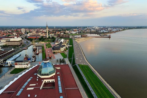 View from above of directional radio tower, shipping museum and Weser, evening sky, city centre,
