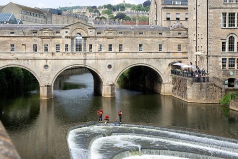 Avon Fire and Rescue Service personnel on weir on River Avon, Pulteney Bridge, city of Bath, north