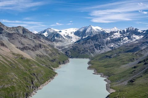 Blue mountain lake in a mountain landscape with glaciers, Lac des Dix reservoir and Mont Blanc de