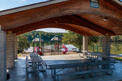 Pavilion, playground and swimming area in the Pin Oak Campground at Natchez Trace State Park near