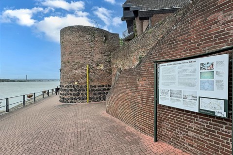View of historic town wall and former customs tower for customs duties on the Rhine promenade of