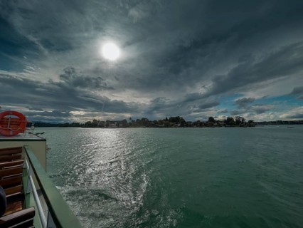 Dark clouds over the Chiemsee, view of the Fraueninsel, Bavaria, Germany, Europe