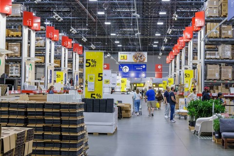 Customers shopping in the warehouse section of IKEA home store