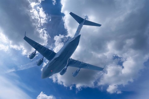 Boing C-17, strategic military transport aircraft of the US Air Force, cloudy sky, Bavaria,