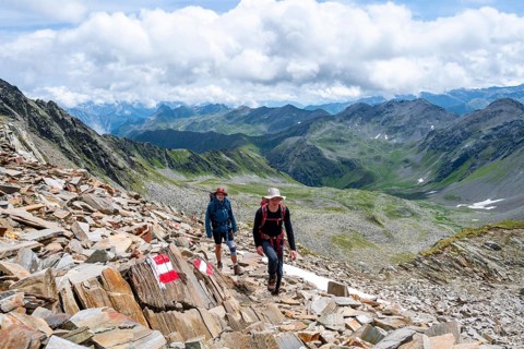 Red and white trail markings, hiker in the high mountains, Lasörling High Trail, Lasörling High