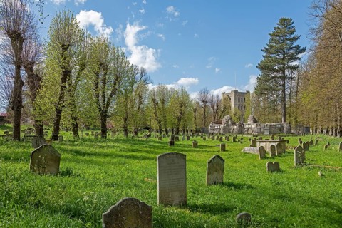 Norman tower, also called church gate, graveyard, gravestones, Bury St Edmunds, West Suffolk,