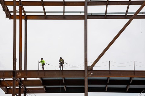 Detroit, Michigan - Workers string safety lines as structural steel rises on a $2.2 billion