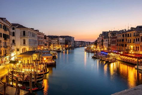 View of the Grand Canal at the blue hour, picturesque evening mood with illuminated palazzos on the