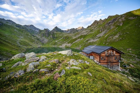 Cabane du Louvie mountain hut and Lac du Louvie mountain lake, Valais Alps, Val de Bagnes, Valais,