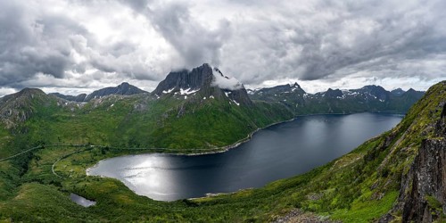 View of Mefjorden fjord from Barden mountain, Breidtind mountain peak behind, Senja, Norway, Europe