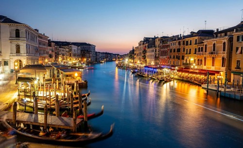 View of the Grand Canal at the blue hour, picturesque evening mood with illuminated palazzos on the