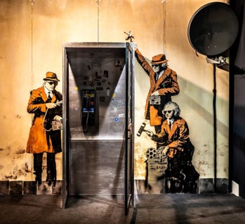 Banksy - Spy Booth, reference to state surveillance, 2014, Cheltenham, UK, exhibition The World of