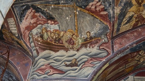 Medieval fresco of a boat with saints on a stormy sea, Apostle John sailing from Ephesus to Patmos,