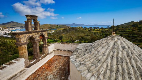 View from the roof with a view of the bell tower and landscape towards the blue sea, Monastery of