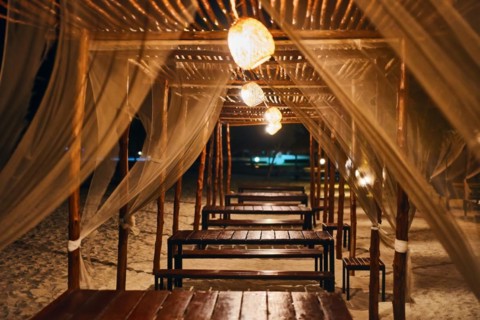 Empty beach restaurant lounge bar with lantern in the evening on tropical island. Summer vacation,