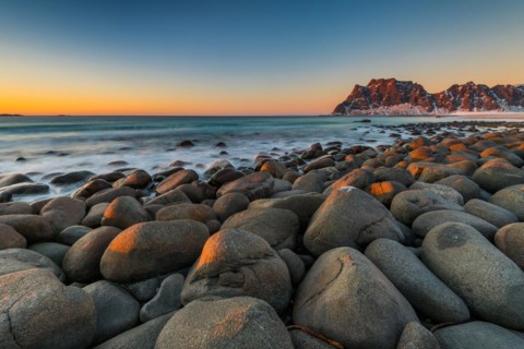 The famous beach near Uttakleiv with round shaped rock boulders on the Lofoten islands in Norway on